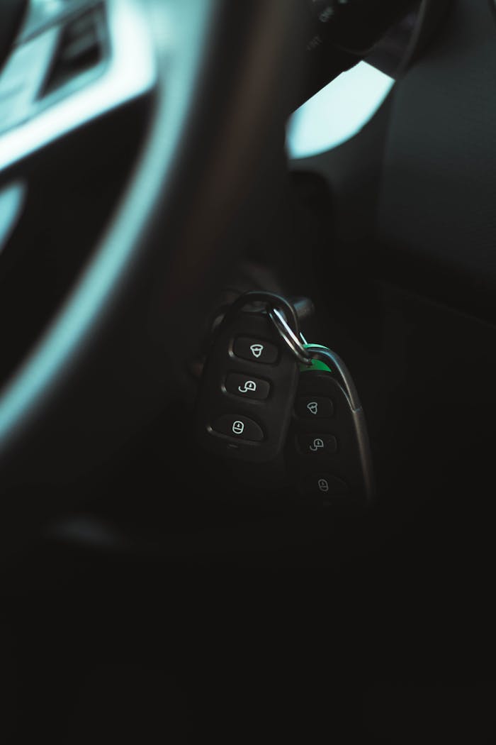 Close-up photo of a car key in the ignition, highlighting modern vehicle interior design.